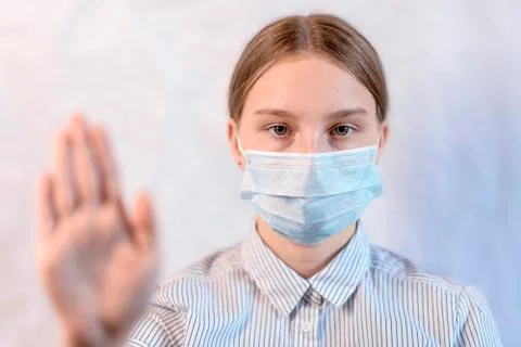 White background, close-up focus face teenager girl medical, stop hand gesture 스톡 사진