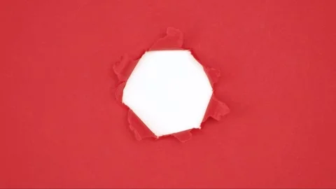 White background is covering with a red sheet of paper tearing from the center Stock Footage 305294739