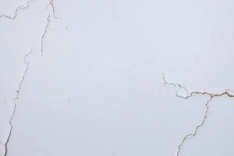 White background with cracks. Torn cracks on the texture. Textured space fo.. Stock Photos