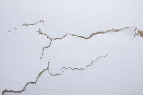 White background with cracks. Torn cracks on the texture. Textured space fo.. Stock Photos