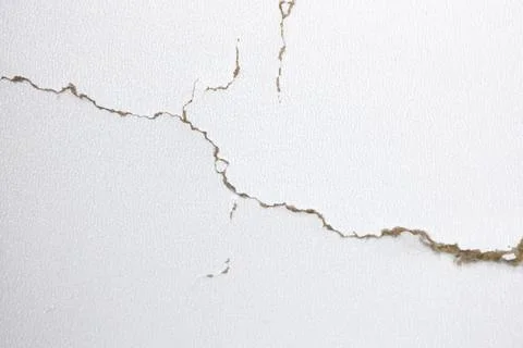 White background with cracks. Torn cracks on the texture. Textured space fo.. Stock Photos