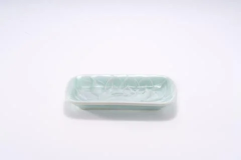 White background cyan reflective ceramic texture lotus shape flat bottom tray Stock Photos
