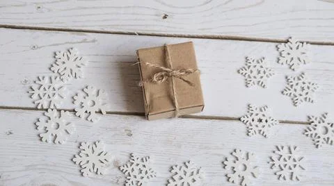 White background decorated the edges with white snowflakes made of economical Stock Photos
