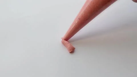 On a white background drawing with cream. cream drawing in the form of a flag 動画素材 139729287
