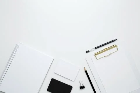 On a white background, an empty mock up notebook and clipboard, white and bla Stock Photos