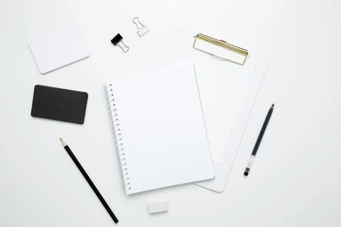 On a white background, an empty mock up notebook and clipboard, white and bla Stock Photos