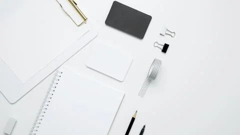 On a white background, an empty mock up notebook and clipboard, white and bla Stock Photos