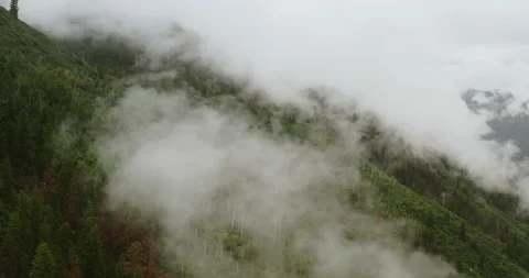 White background, flying through clouds and over mountain Stock Footage 201618680