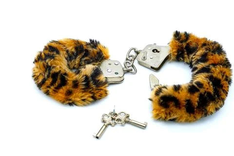 White background, isolate. Fluffy bondage with leopard color for sexual game. Stock Photos