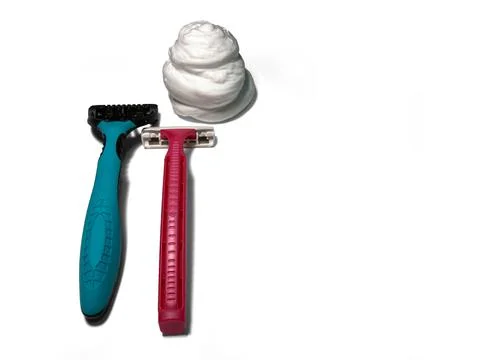 On a white background on the left are two razors. Male and female. Stock Photos