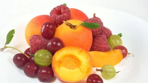 On a white background lie fruit and berries Video stock 77715071