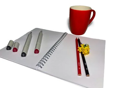 On a white background lies a blank notebook for drawing. Stock Photos