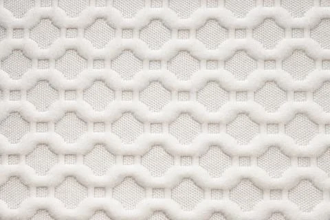 White background from mattress textile. Texture. Abstract seamless pattern. Stock Photos