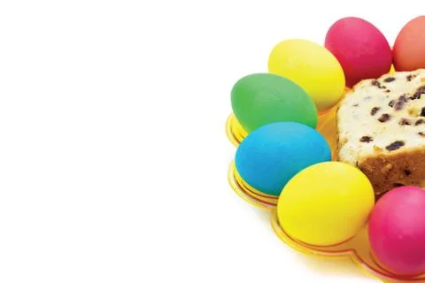 White background with multi-colored Easter eggs and cakes Stock Photos