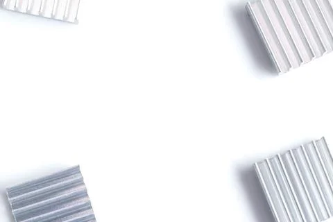 White background with silver metallic corrugated panels at each corner Stock Photos