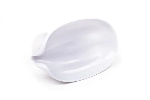 On a white background. silver soap dish, in the shape of a droplet. close-up. Stock Photos