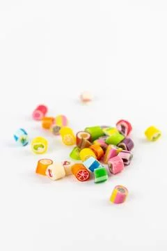 On white background in a small multi-colored sugar caramels with different Stock Photos