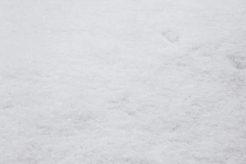 White background. The texture of the surface of the snow. Foto stock