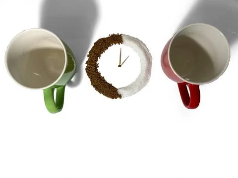 On a white background there are two cups, green and red. Stock Photos