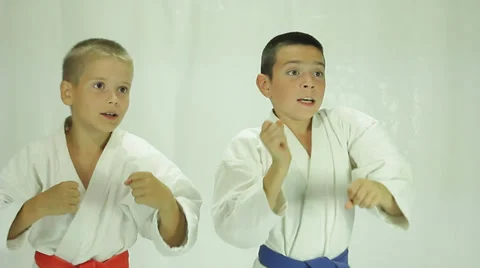 On a white background two athlete beat a punch hand Stock Footage 27449141