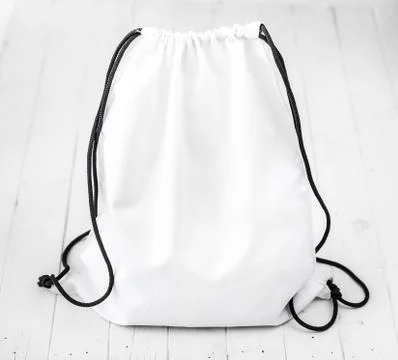 White backpack with black string Stock Photos