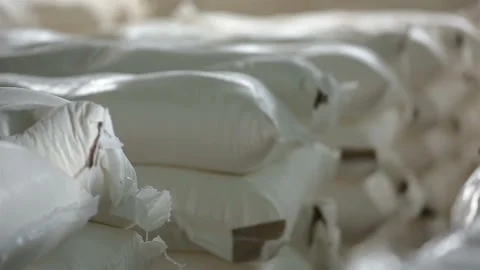 White bags of flour in stock Stock Footage 128654553