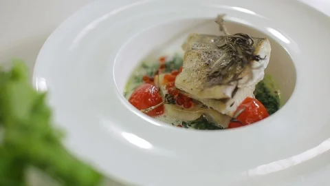 White baked fish dish presentation Stock Footage 92912567
