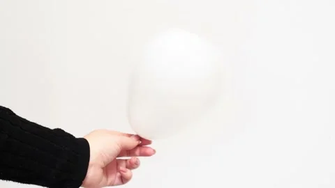 White ballon in shape of heart on white background, studio 4k footage. St.Valent Stock Footage 232023355