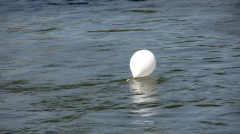 White balloon in a river 1  Stock Footage 233485