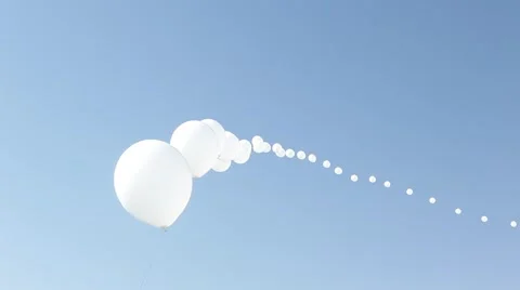 White balloons floating in air during festival Stock Footage 51231433