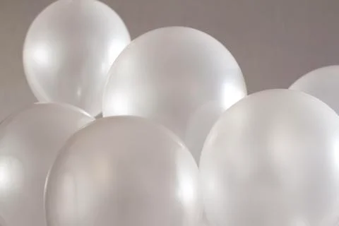 White balloons on grey background	 Stock Photos