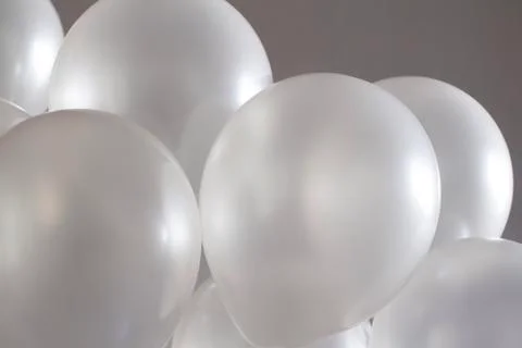 White balloons on grey background	 Stock Photos
