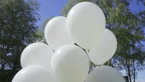 White balloons on the street Stock Footage 163567223