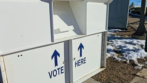 White ballot drop-off box for mail-in election voting displays Vote Here Stock Footage 340264607