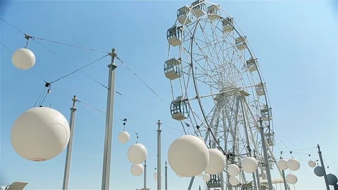 White balls on the background of the Ferris wheel (timelapse) Stock Footage 93414613