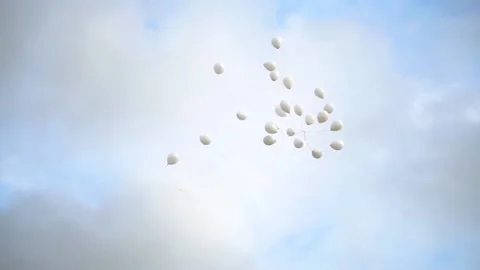 White Baloons Flying Into The Sky Stock Footage 157693143