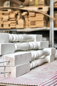 White balusters. Balusters process production. Solid wood balusters before Stock Photos