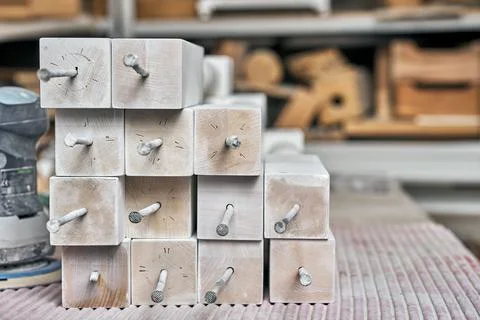 White balusters. Balusters process production. Solid wood balusters before Stock Photos