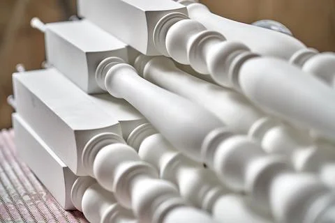 White balusters. Balusters process production. Solid wood balusters before 写真素材