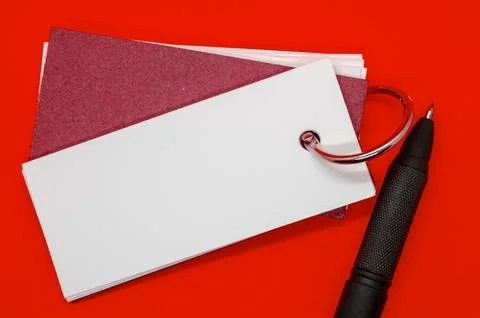 White banner shape notepad with customizable space for text on dark red cov.. Stock Photos