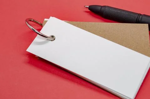 White banner shape notepad with customizable space for text on red background Stock Photos