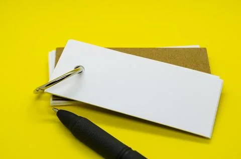 White banner shape notepad with customizable space for text on yellow cover.. Stock Photos