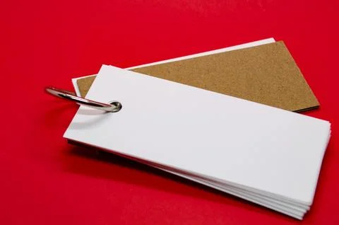 White banner shape notepad with customizable space for text on red cover ba.. Stock Photos