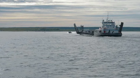 A white barge sailing through the open sea to deliver the export products Stock Footage 280008960