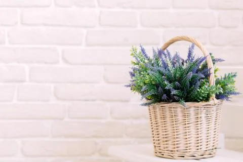 White basket with lavender flowers bouquet Stock Photos