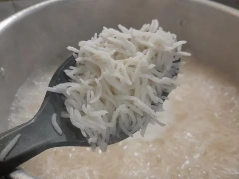 White basmati rice on a spoon when ready for meal Фото