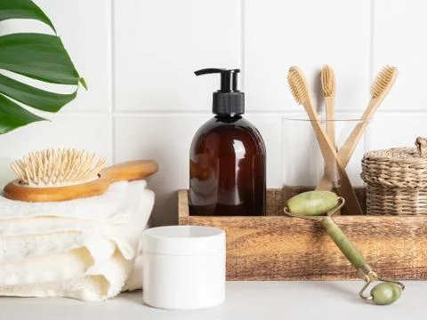 White bath background front view with cosmetics and accessories Stock Photos