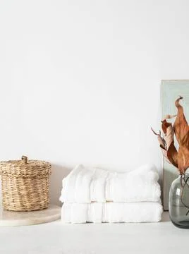 White bath background front view with ceramic vase, white towels and decorati Stock Photos