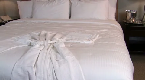 White bathrobe on bed dolly - HD Stock Footage 1003581