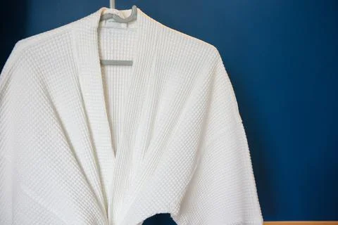 White bathrobe with blue background Stock Photos